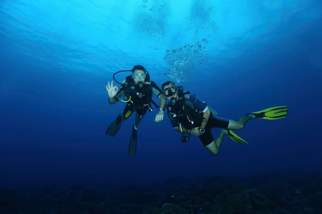 Scuba diving in the clear waters of Tablas Island at Dreamshore Kiwi Beach Resort